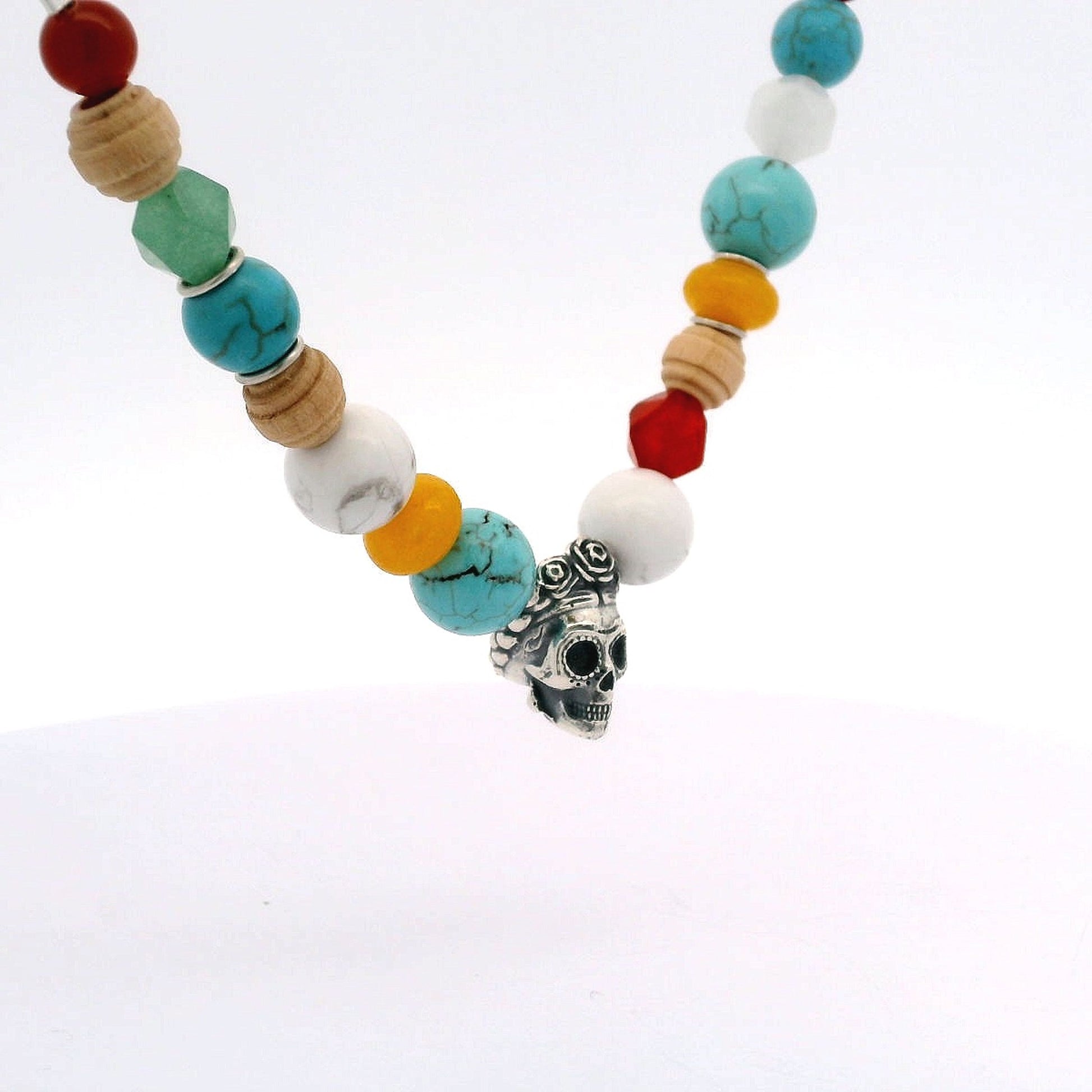 Beaded Sugar Skull Necklace inspired by Frida Kahlo, featuring a silver skull charm and eclectic semi-precious stones. A bold, handmade celebration of her style.