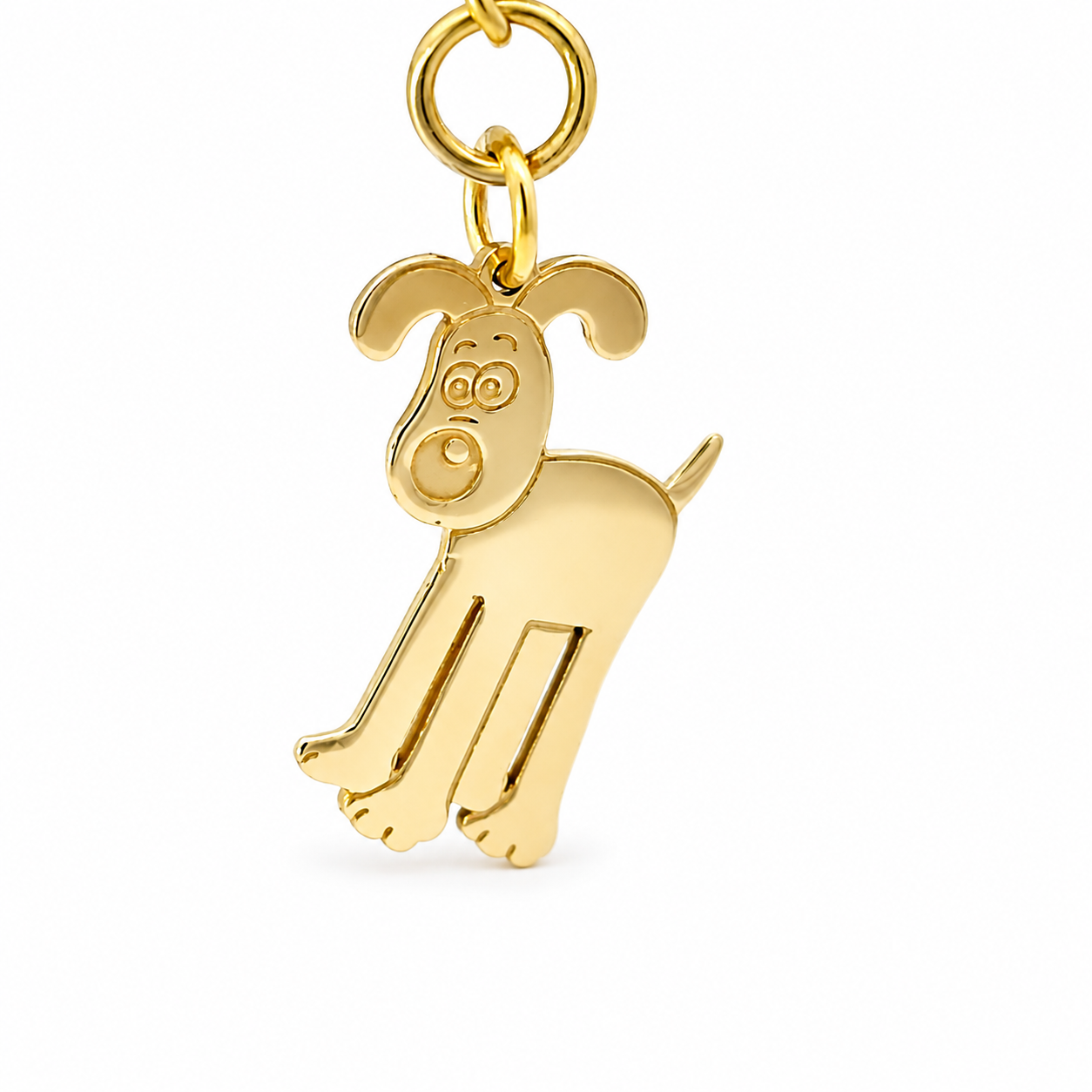 Close up of Gold Gromit keyring styled as a bag charm.