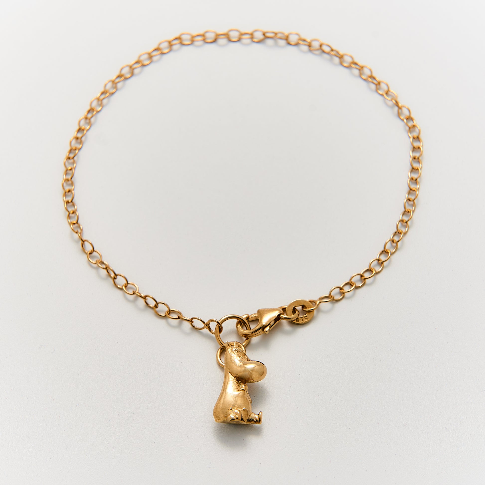 Handcrafted 18ct Gold Vermeil Snorkmaiden bracelet from the Moomins, featuring the character's signature curly hair and gold anklet, made from recycled sterling silver.