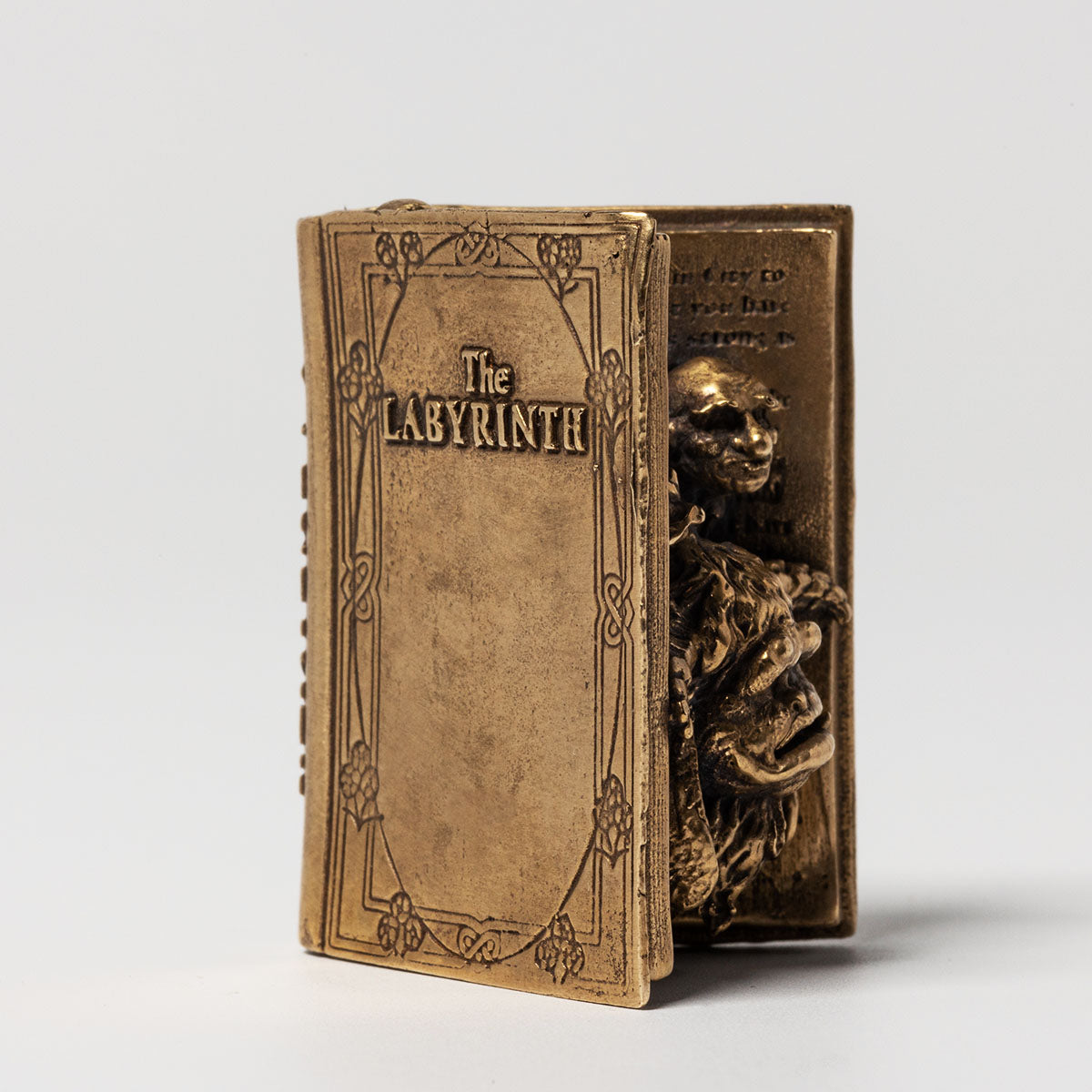 Labyrinth Miniature Bronze Character Book, handcrafted with intricate detail. Features Sarah’s iconic book from Jim Henson’s Labyrinth, with Ludo, Hoggle, and Sir Didymus emerging from its pages. A unique collectable for fans of the 80s classic.