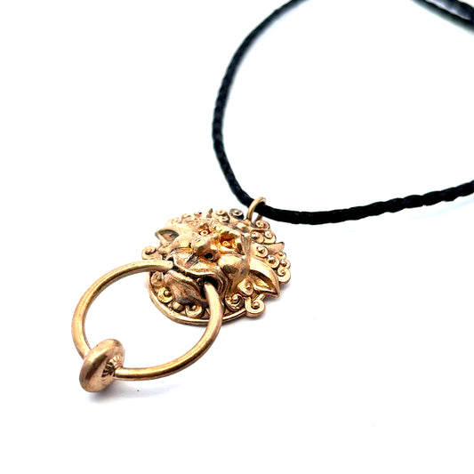 Licensed To Charm Labyrinth Left Door Knocker bronze necklace on adjustable black cord, front view