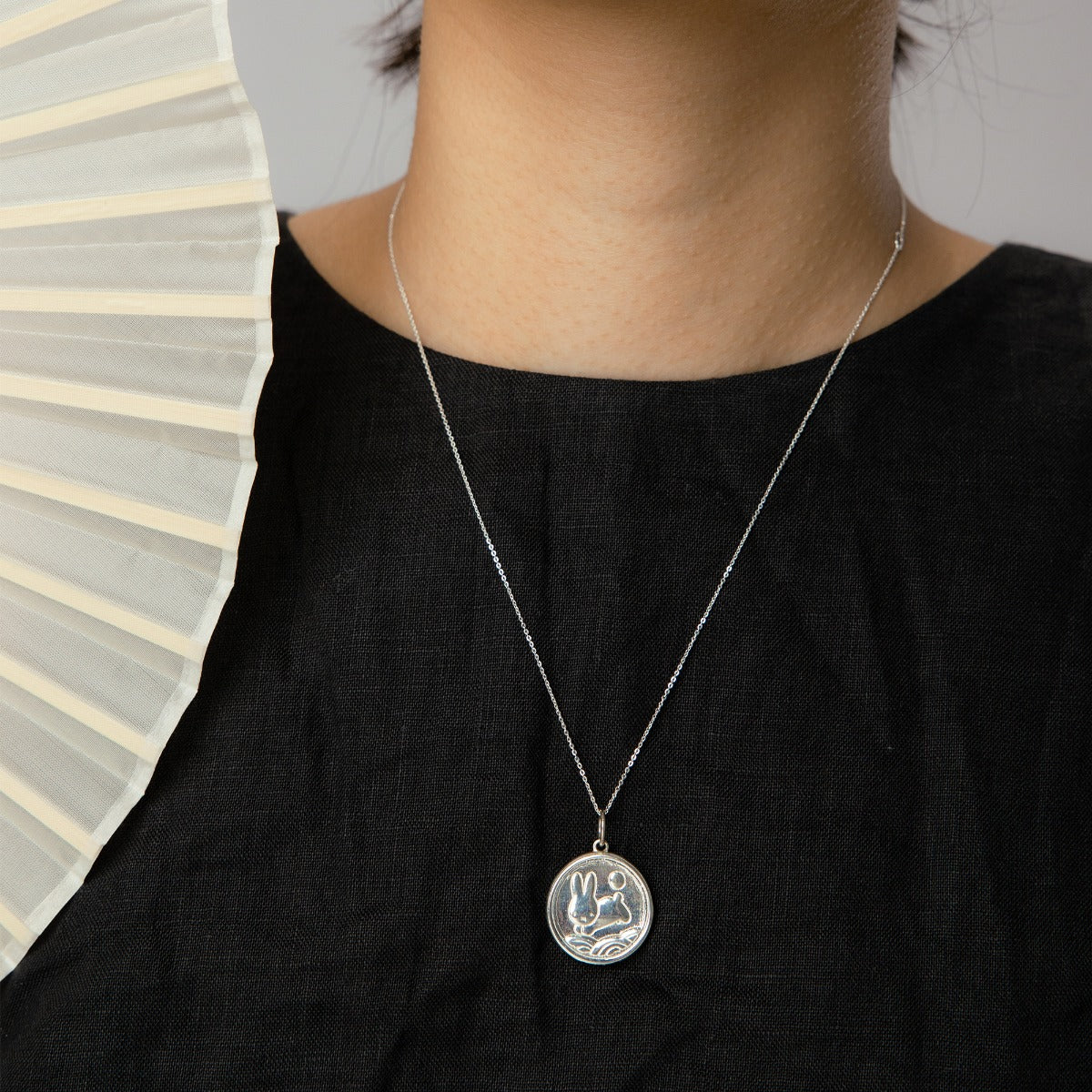 Licensed to Charm Miffy Medallion Necklace in sterling silver worn by model, handmade in the UK, Miffy jewellery gift.