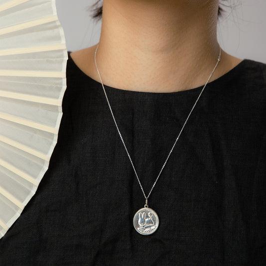 Licensed to Charm Miffy Medallion Necklace in sterling silver worn by model, handmade in the UK, Miffy jewellery gift.