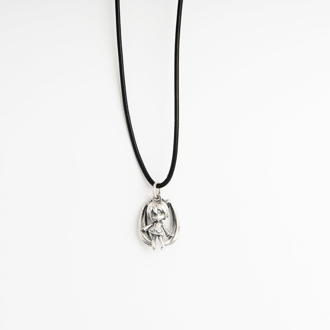 Front-facing view of Hatsune Miku Necklace with sterling silver pendant on a black leather necklet, showing flowing twintails and skirt detail.