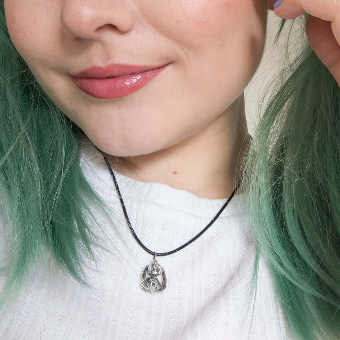 LicensedToCharm Hatsune Miku sterling silver necklace on black leather necklet worn by model, handmade in the UK, inspired by the iconic J-pop Vocaloid character.
