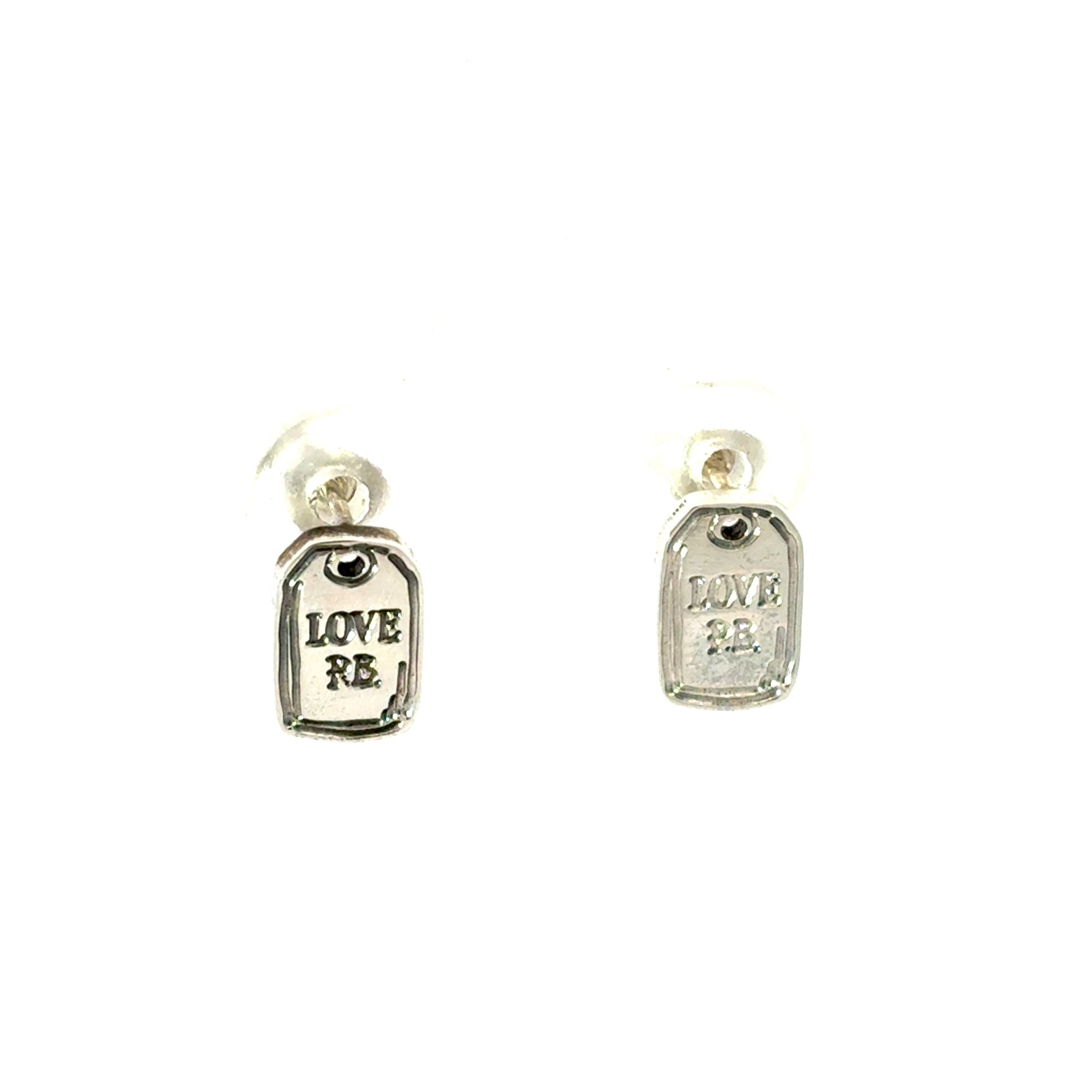 Close-up of engraved “LOVE PB” luggage tag design in sterling silver earrings by Licensed To Charm