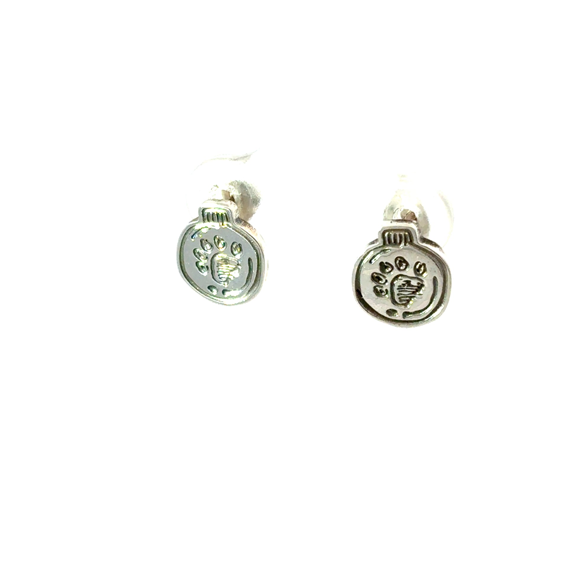 Close-up of Licensed To Charm handcrafted sterling silver Paddington pawprint studs showing engraved detail