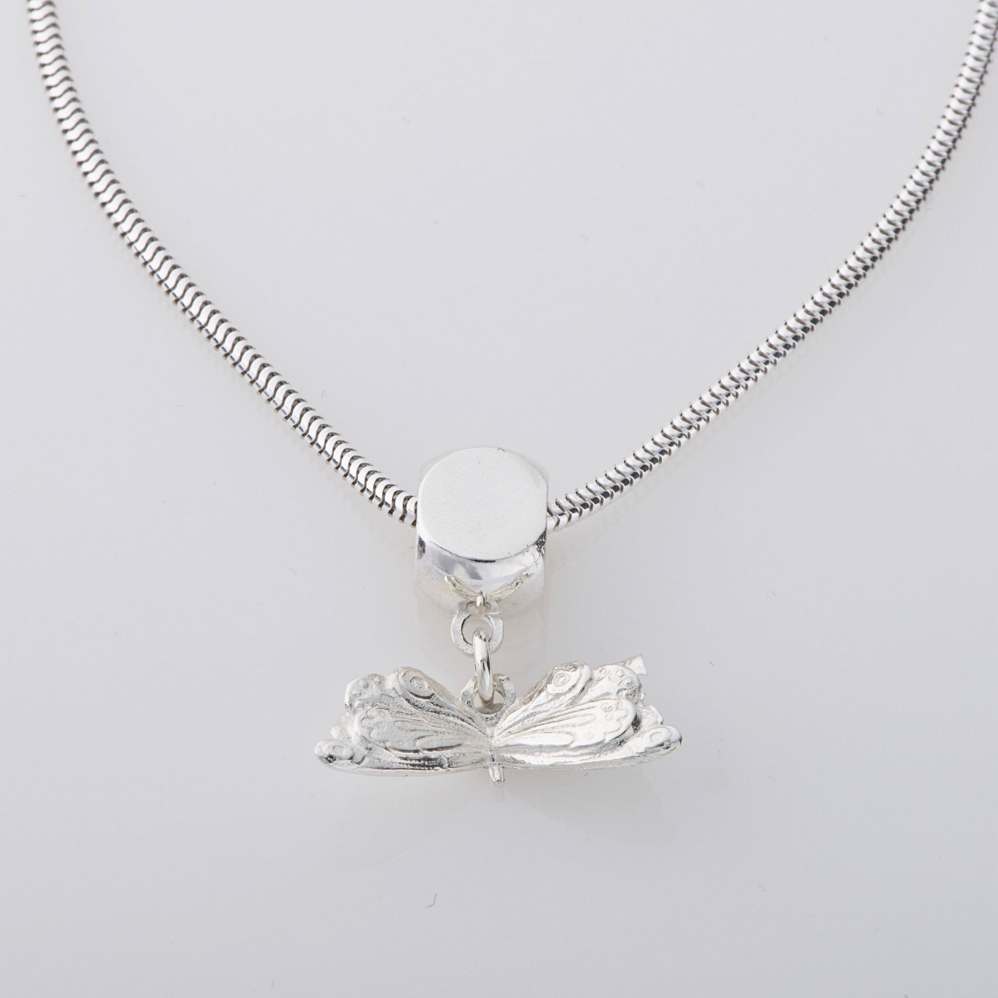 Licensed To Charm Handmade Very Hungry Caterpillar Butterfly Dangle Necklace in sterling silver, featuring an etched butterfly charm inspired by Eric Carle’s classic children’s book. A whimsical jewellery gift for all ages.