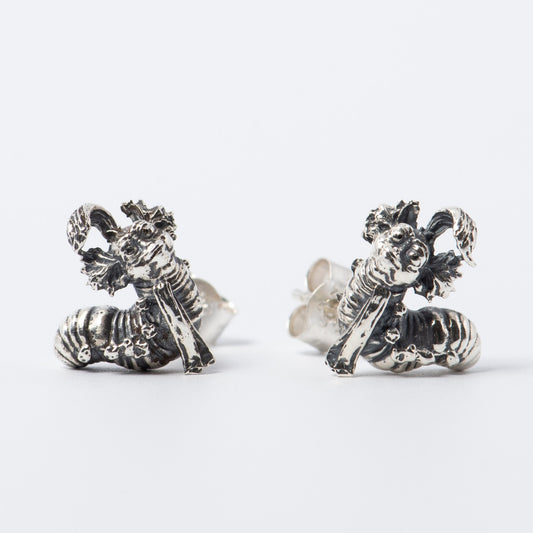 Licensed To Charm Labyrinth Worm Stud Earrings in sterling silver. Features the charming and quirky Worm character from Jim Henson’s Labyrinth, intricately handcrafted with secure stud backs. Playful and eco-friendly, perfect for daily wear.
