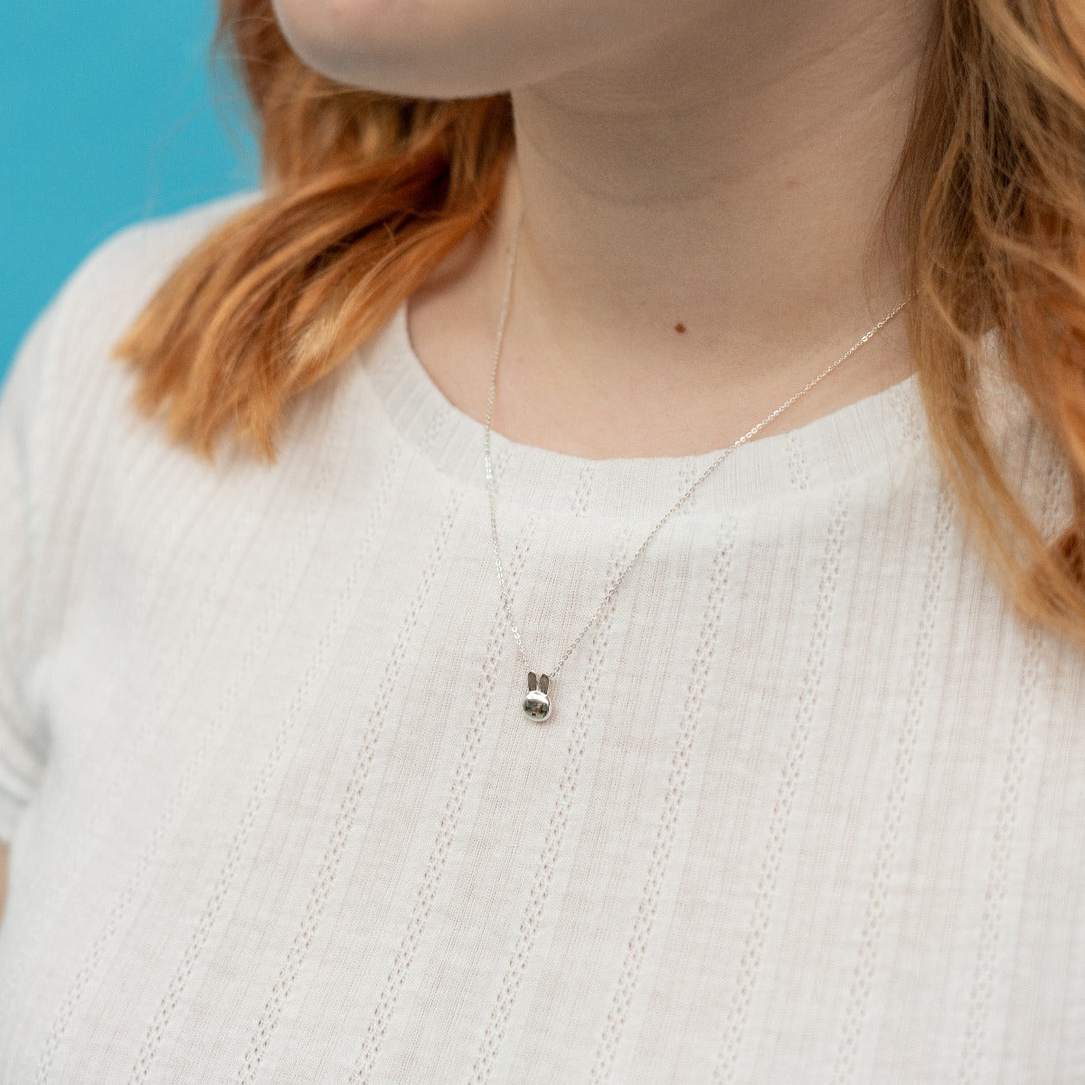 Handcrafted Miffy Mini Charm Necklace in sterling silver, with a petite Miffy head charm on a fine chain. Perfect for adding fun to any outfit.
