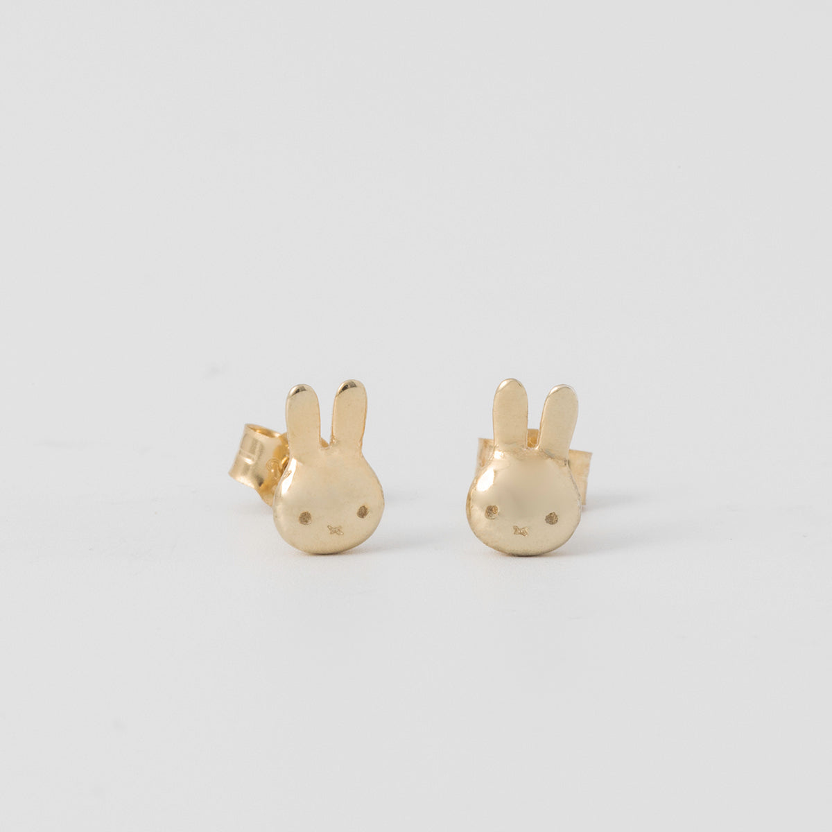 Miffy Mini Head stud earrings in 18ct gold vermeil, worn on ear, handmade in the UK