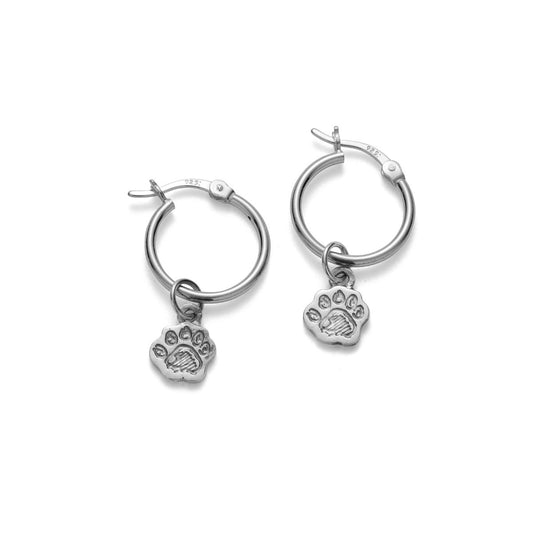 Paddington™ Paw Hoop Earrings in sterling silver, handmade UK jewellery with engraved pawprint charms hanging from polished hoops.