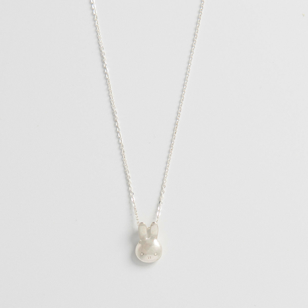Licensed To Charm Miffy Medium Head Charm Necklace in sterling silver, featuring a playful movable design. A perfect handmade gift for Miffy fans and rabbit lovers.