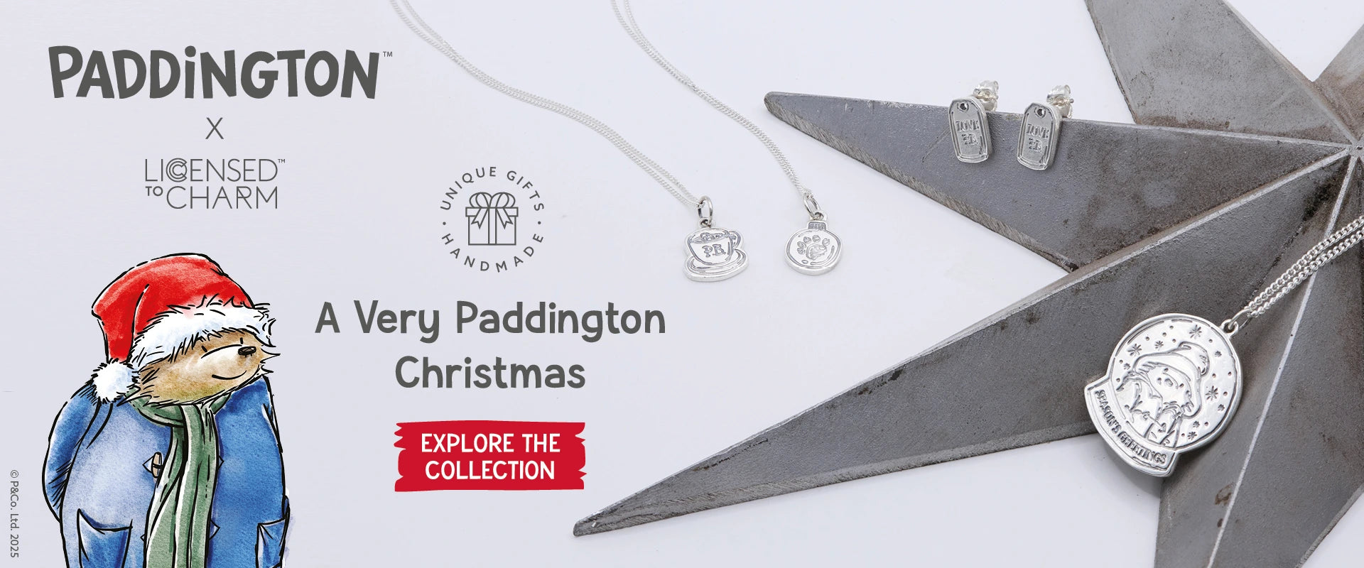 Licensed to charm christmas Jewellery collection with Paddington Bear theme on a white Christmassy background