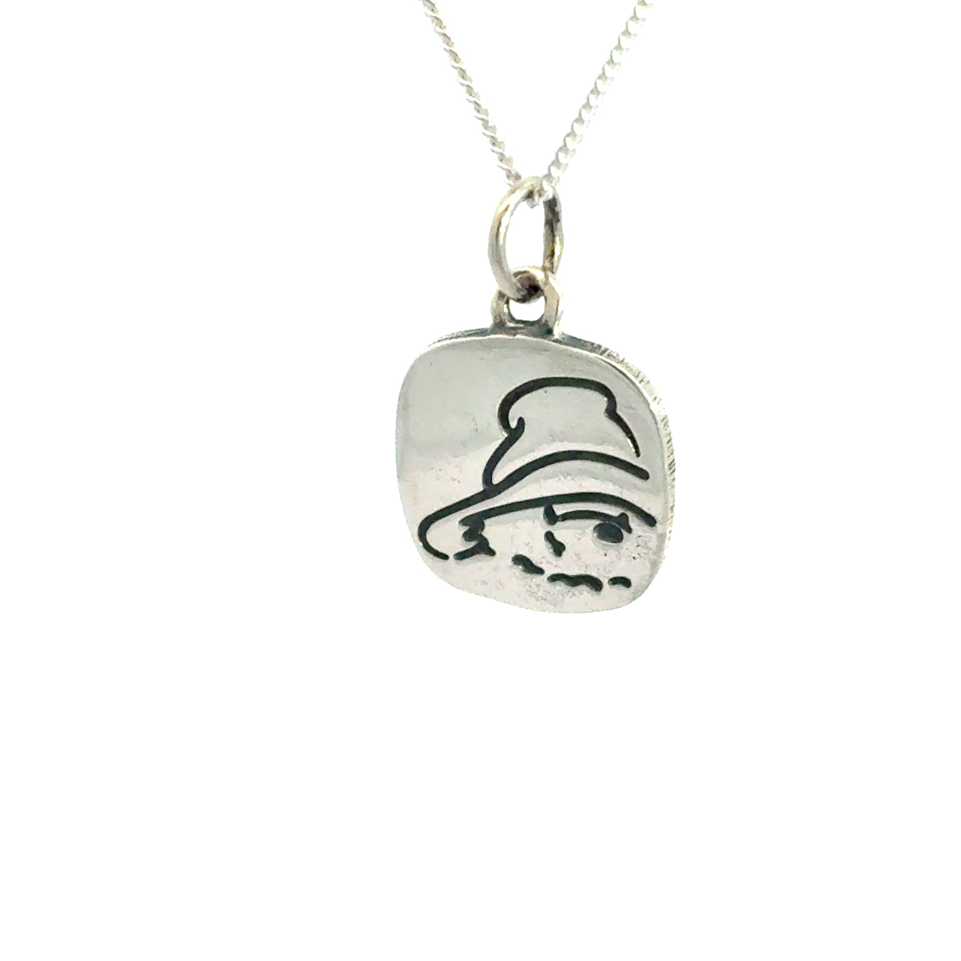 Side angle of Paddington Bear square pendant necklace in silver