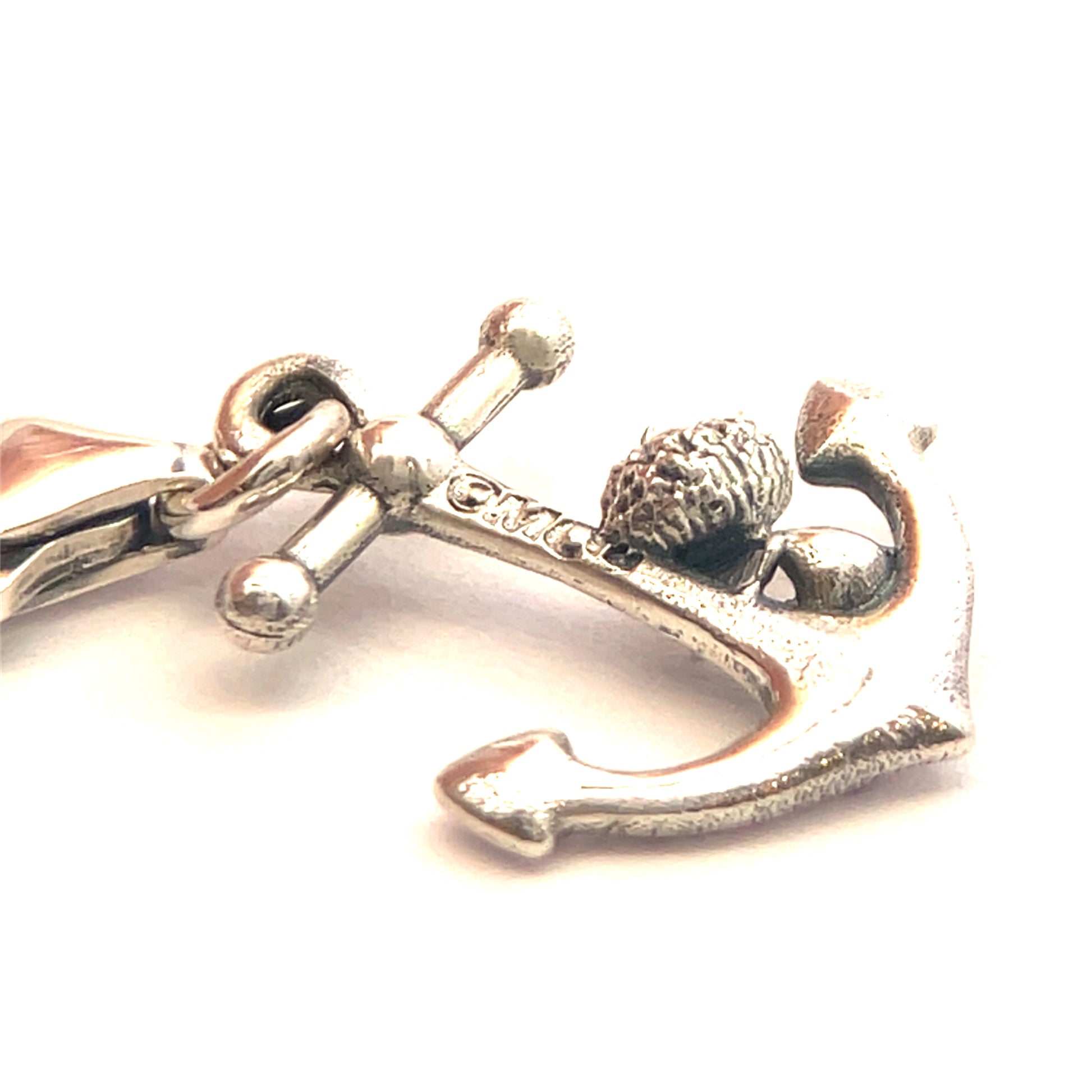 Detailed sterling silver charm of Bob seated on an anchor, crafted with a clip-on clasp for easy attachment to charm jewellery.