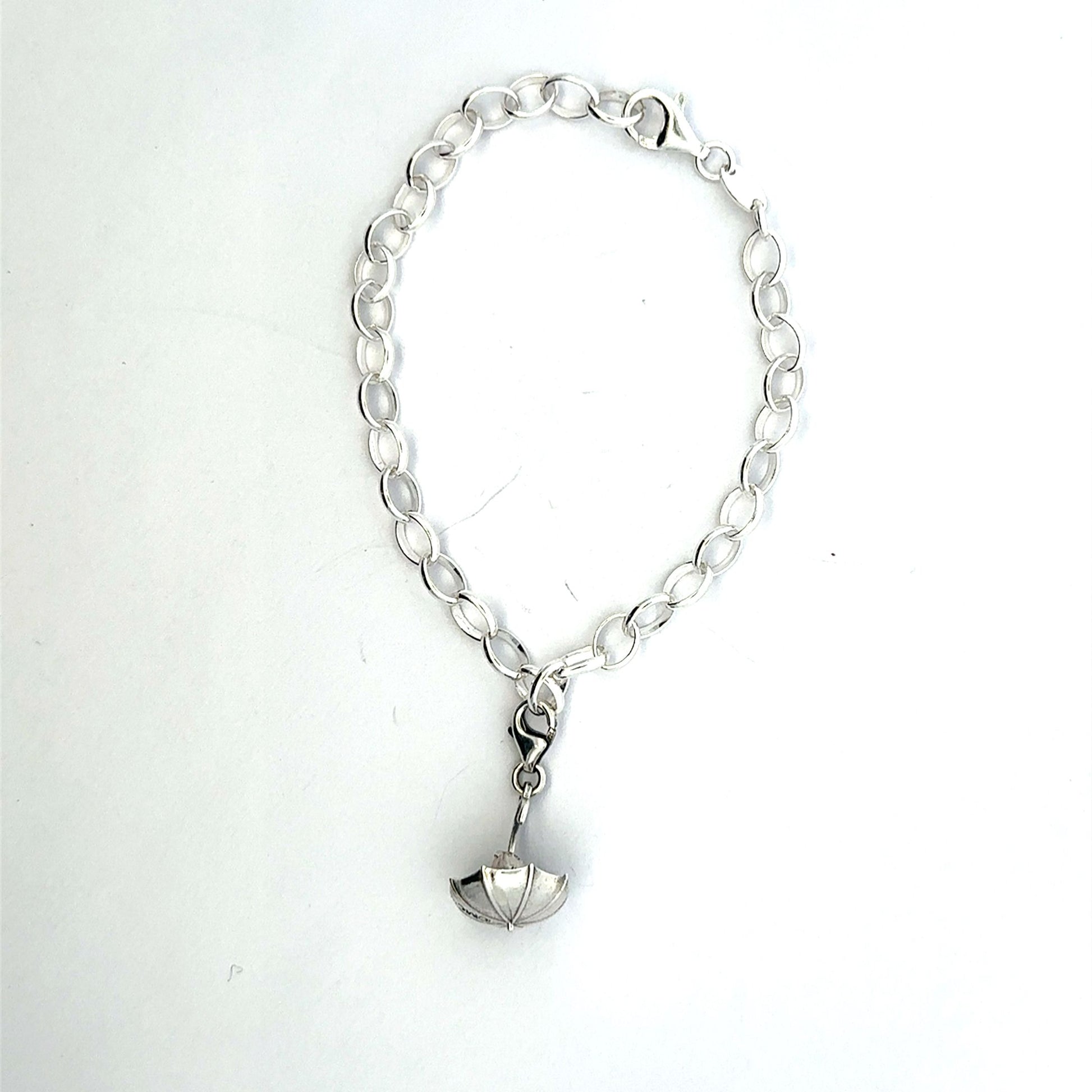 Sterling silver Moomin Nibling Umbrella Charm Bracelet featuring a Nibling peeking out from under an umbrella.