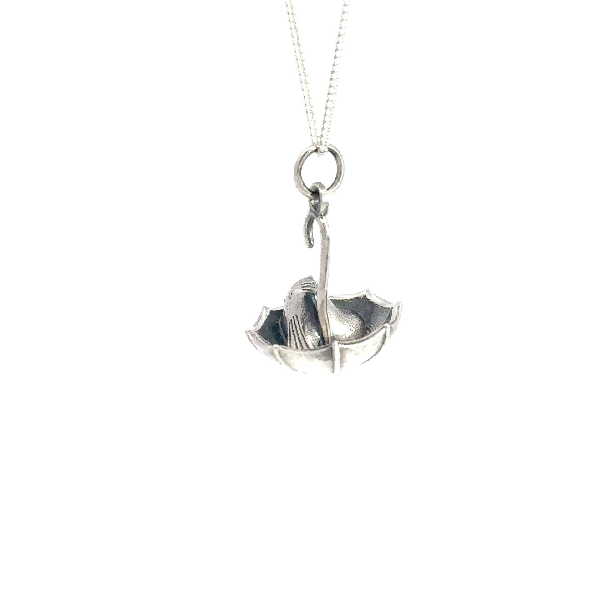 Handmade Nibling Umbrella Necklace in recycled sterling silver, capturing the playful spirit of a Nibling under an umbrella