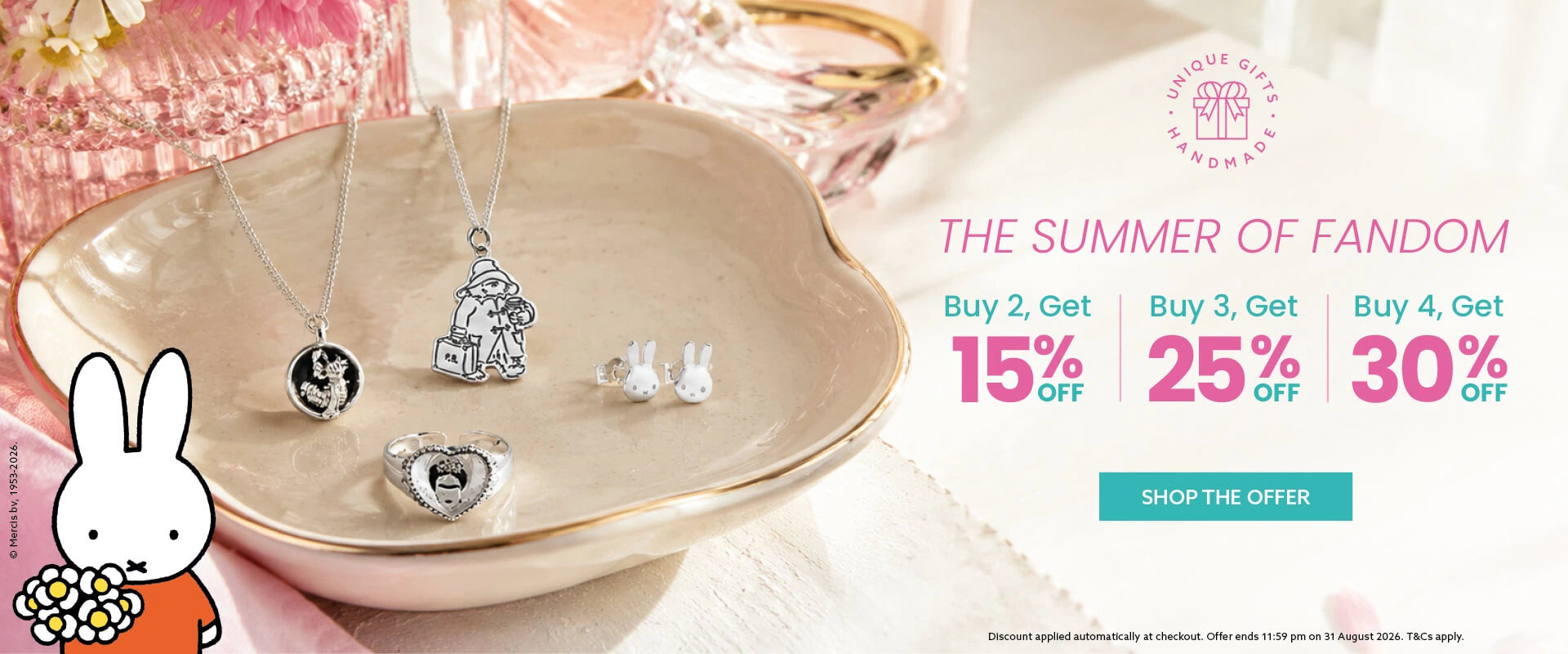 Licensed To Charm promotional banner for 'Unique Gifts and Jewellery' featuring silver jewellery pendants and earrings displayed on a beige ceramic dish. The banner includes text for 'The Summer of Fandom' with discount offers: Buy 2, Get 15% Off; Buy 3, Get 25% Off; Buy 4, Get 30% Off.
