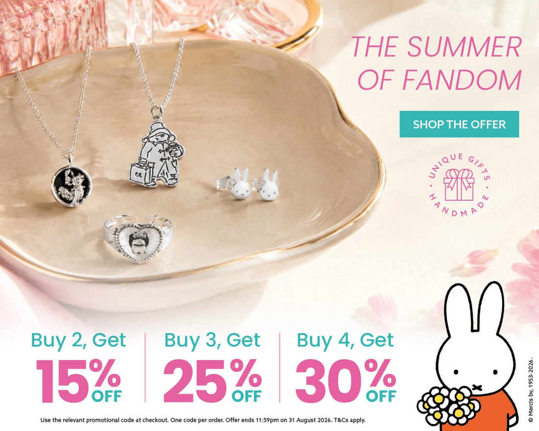 Licensed To Charm promotional banner for 'Unique Gifts and Jewellery' featuring silver jewellery pendants and earrings displayed on a beige ceramic dish. The banner includes text for 'The Summer of Fandom' with discount offers: Buy 2, Get 15% Off; Buy 3, Get 25% Off; Buy 4, Get 30% Off.