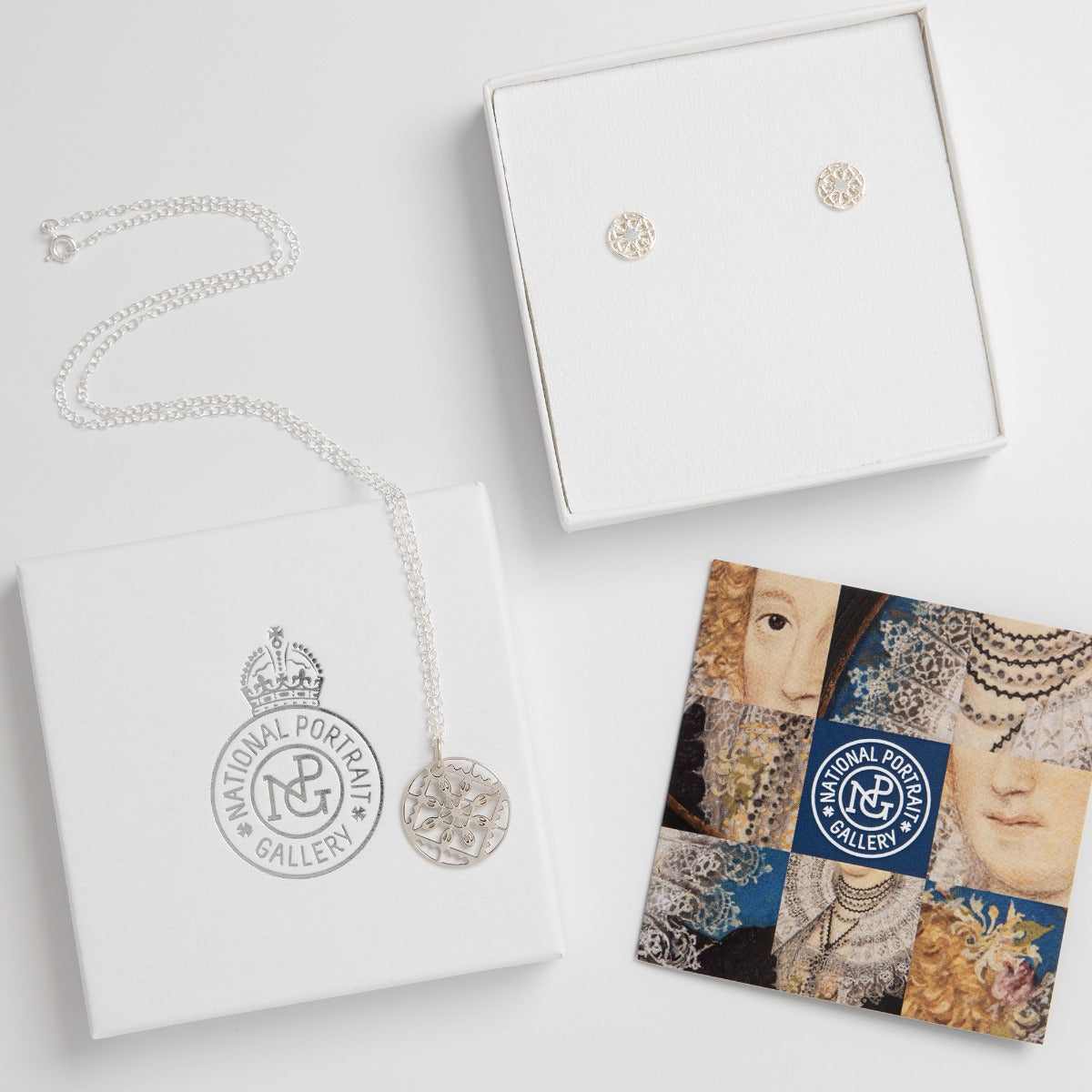 Sterling Silver Elizabethan Lace Jewellery Gift Set featuring a finely etched lace pendant necklace and matching stud earrings, inspired by Renaissance fashion.