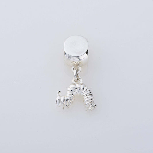 Sterling silver Very Hungry Caterpillar dangle charm, handmade in the UK, featuring Eric Carle’s beloved caterpillar design.