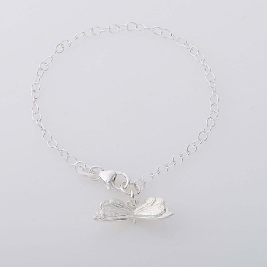 Sterling silver butterfly charm bracelet inspired by The Very Hungry Caterpillar, handcrafted in the UK. A whimsical jewellery gift for all ages.