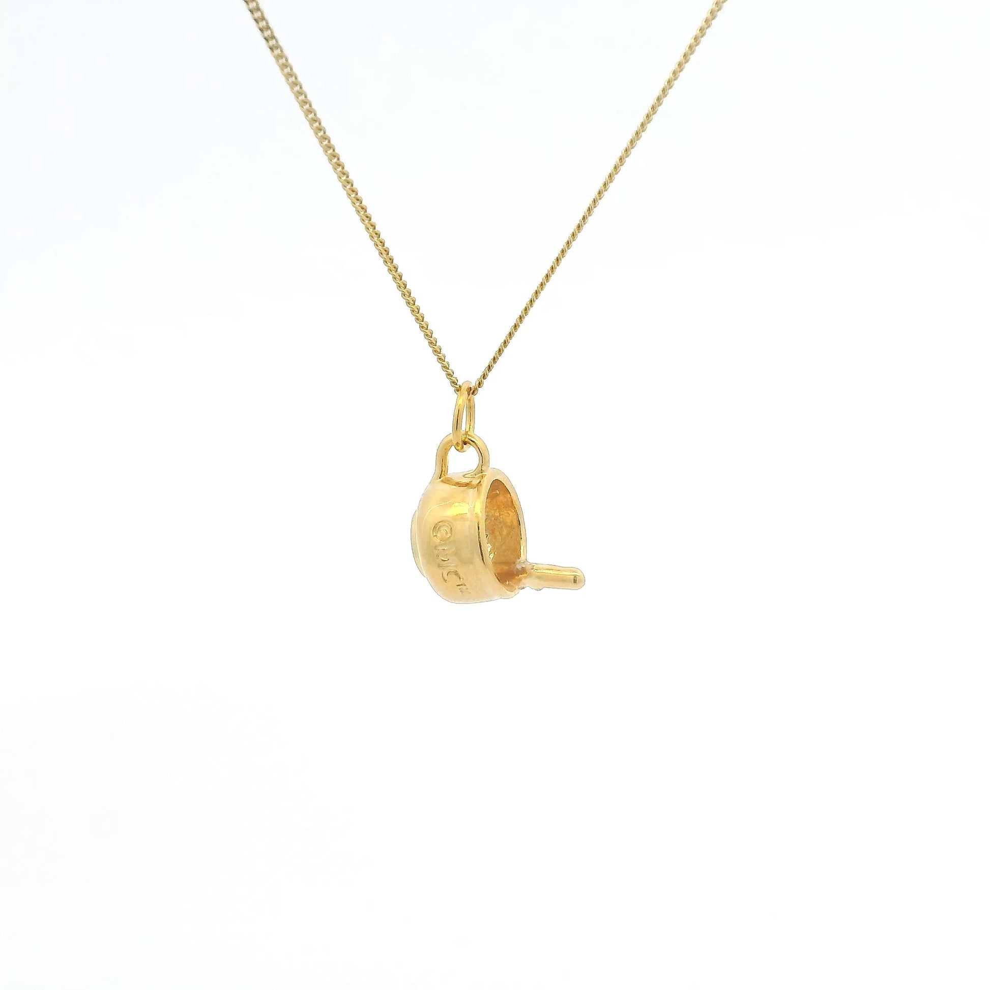 Gold necklace with a unique pendant on a white background