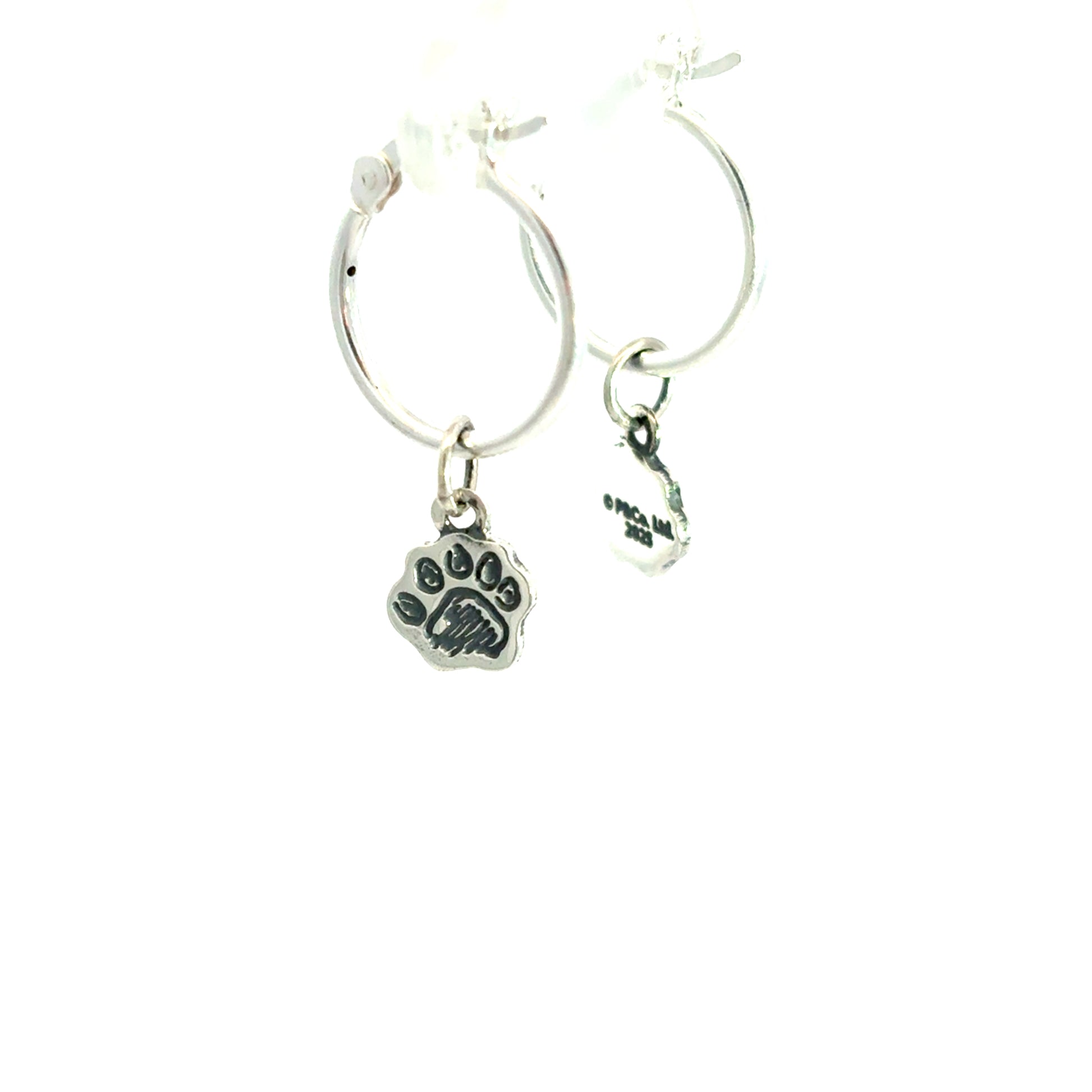Official Paddington Bear Silver hoop earrings with paw print charms on a white background