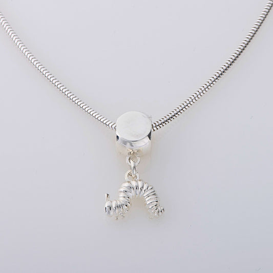 Handmade Very Hungry Caterpillar Dangle Necklace in sterling silver, featuring an intricately detailed caterpillar charm inspired by Eric Carle’s classic book. A fun jewellery gift for all ages.