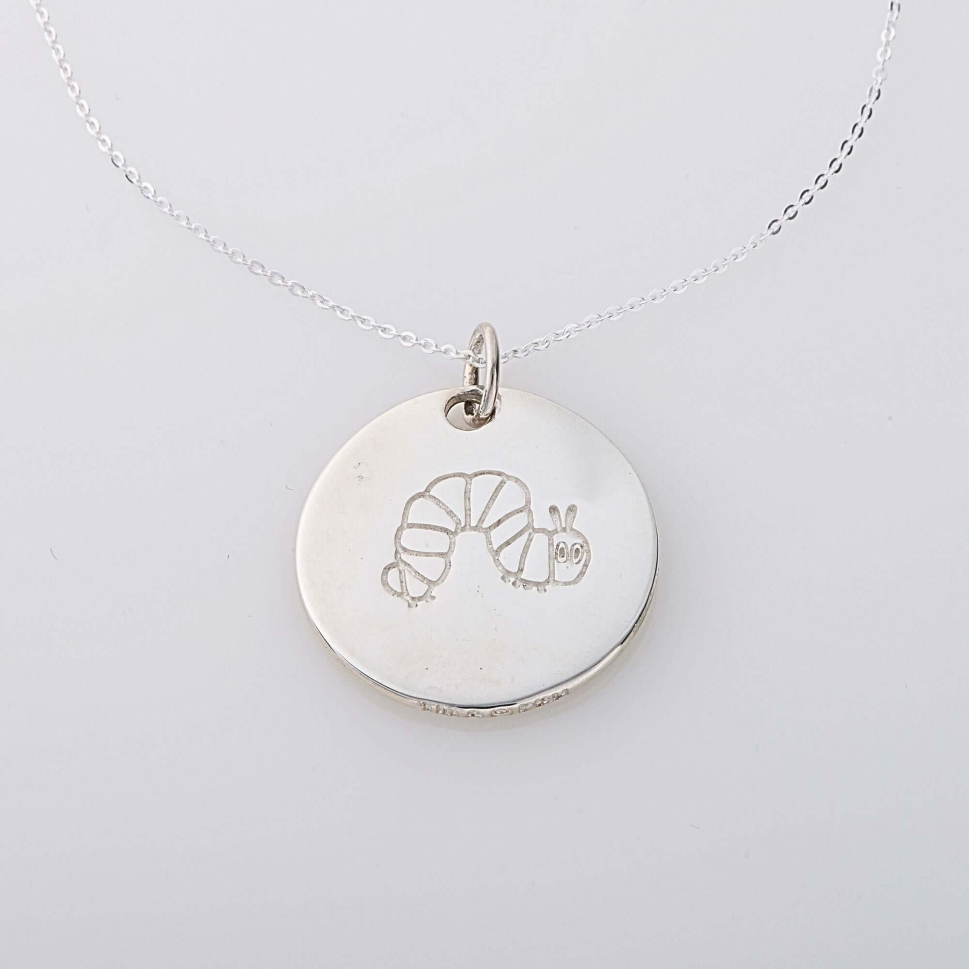 Sterling silver Very Hungry Caterpillar Large Disc Necklace with etched caterpillar design.