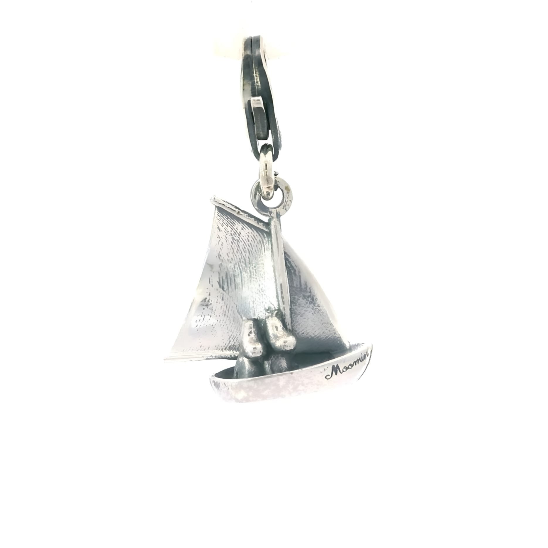 Sterling silver Moomin Sailing Boat Charm with clip-on clasp, featuring Moomintroll and Snorkmaiden sitting together in a boat.