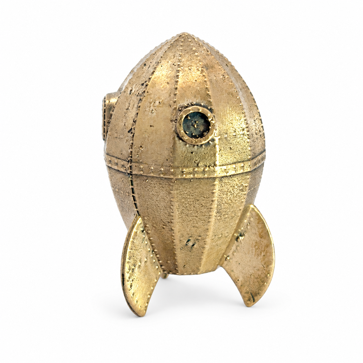 Detailed view of the handmade bronze Wallace & Gromit rocket collectable, featuring its porthole, textured surface and three rocket fins.