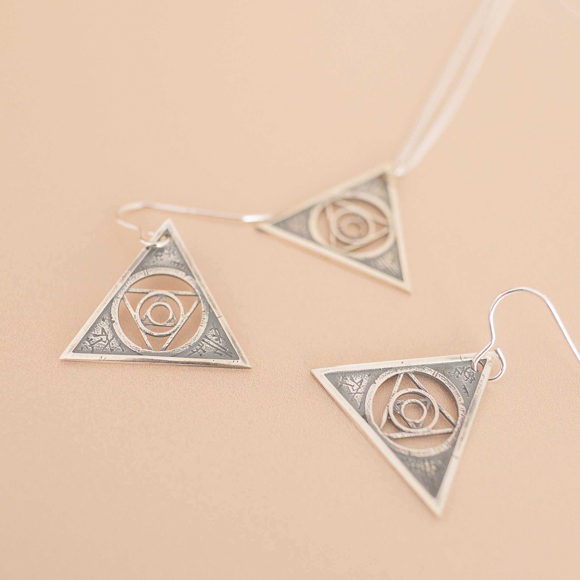 Handcrafted 18ct gold vermeil Aughra's Triangle Earrings, inspired by the astronomical wisdom of Aughra in Jim Henson’s The Dark Crystal. Delicate Gothic elegance for fans and jewellery lovers alike.