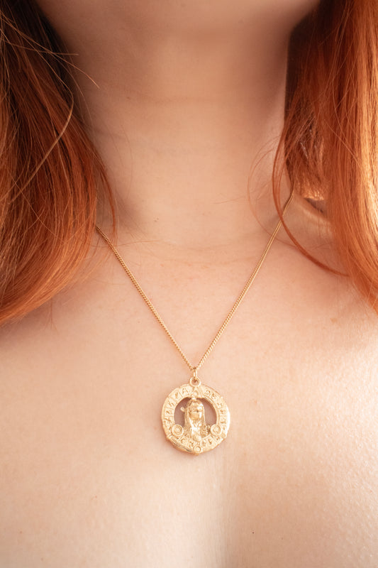 Aughra's Triangle Necklace in 18ct gold vermeil, inspired by The Dark Crystal. Features the Eye of the superimposed suns within an intricate triangle design on a 45 cm trace chain. Ideal for fans of Jim Henson’s iconic fantasy world