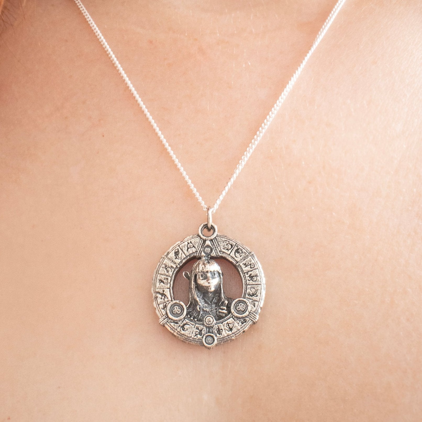 Handcrafted sterling silver Aughra's Triangle Necklace, featuring the Eye of the superimposed suns in a triangle design. Inspired by The Dark Crystal, perfect for collectors and fantasy fans