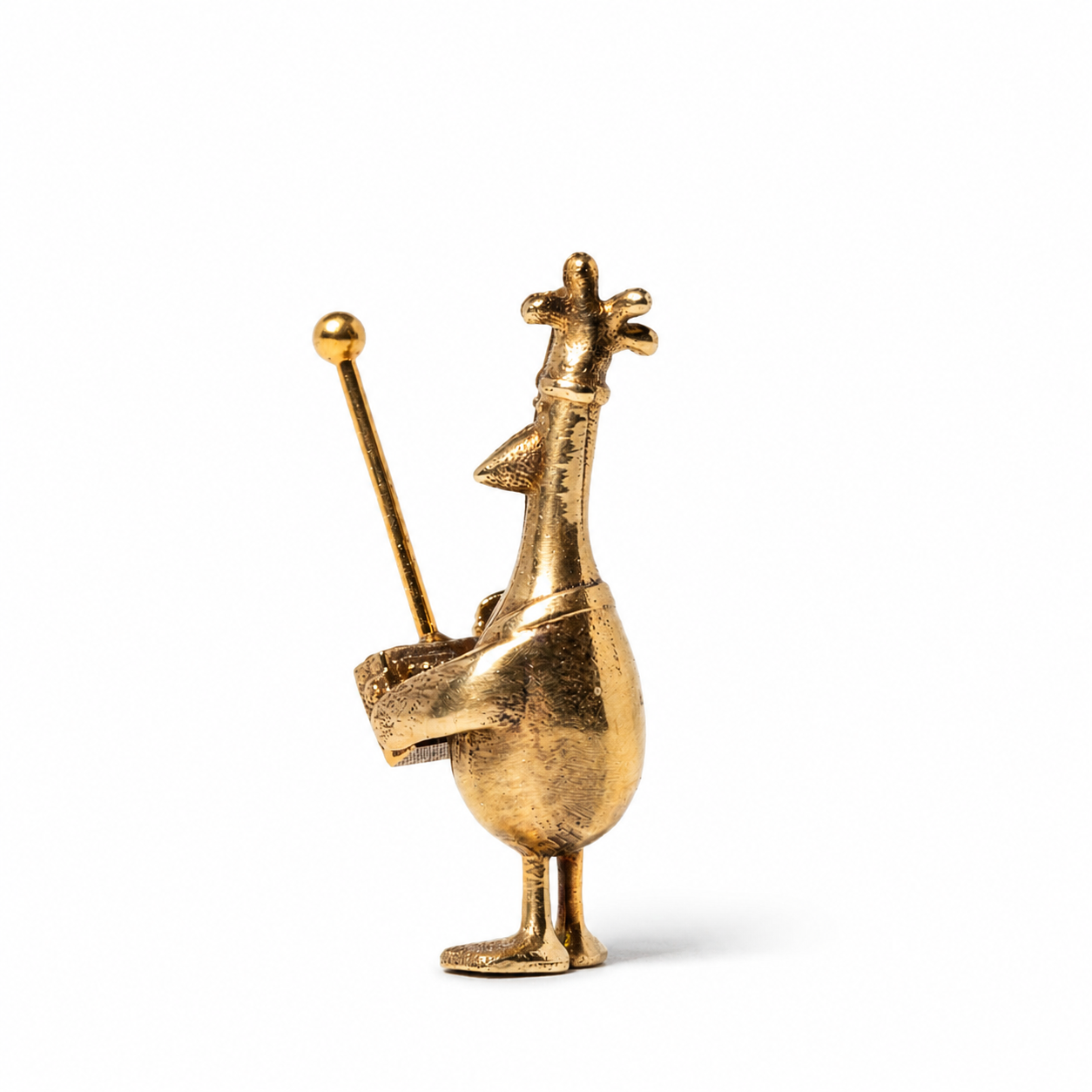 Left-side view of Feathers McGraw miniature bronze figurine holding a remote control with antenna.