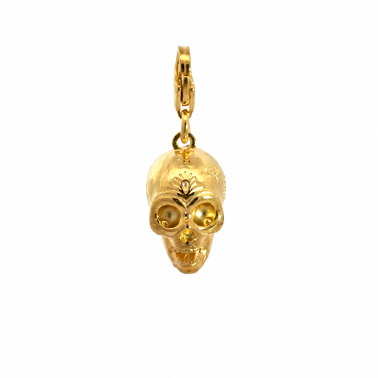 Front view of the Frida Kahlo Calavera Skull Charm in 18ct gold vermeil, showing its decorative forehead detail and lobster clasp.