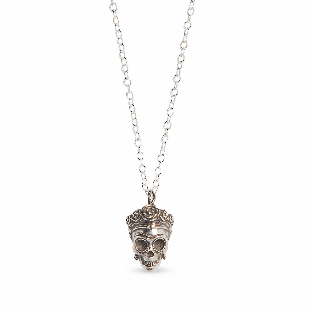 Sterling silver Frida Kahlo-inspired sugar skull necklace with floral headpiece on a clean white background.