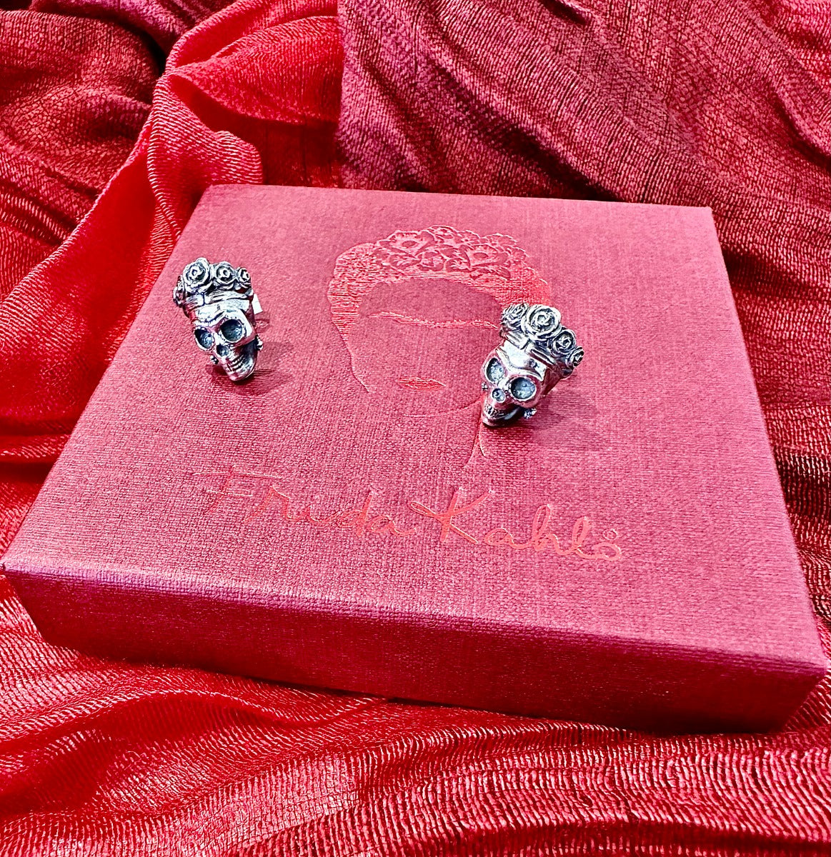 Frida Kahlo sugar skull stud earrings presented in a red Frida Kahlo gift box