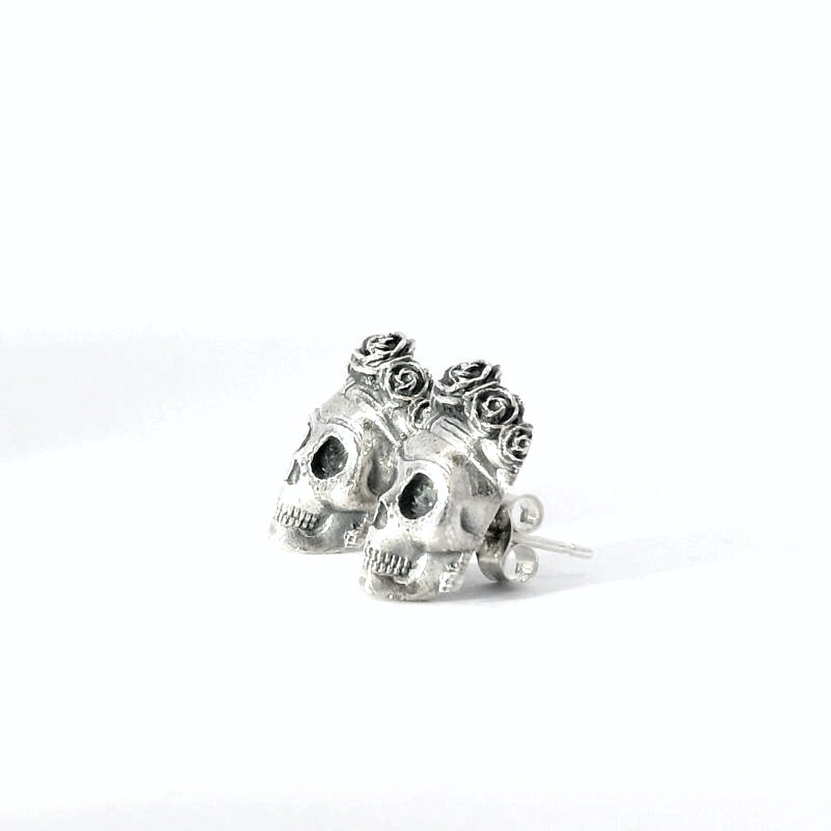 Frida Kahlo sugar skull stud earrings handcrafted in sterling silver angled 