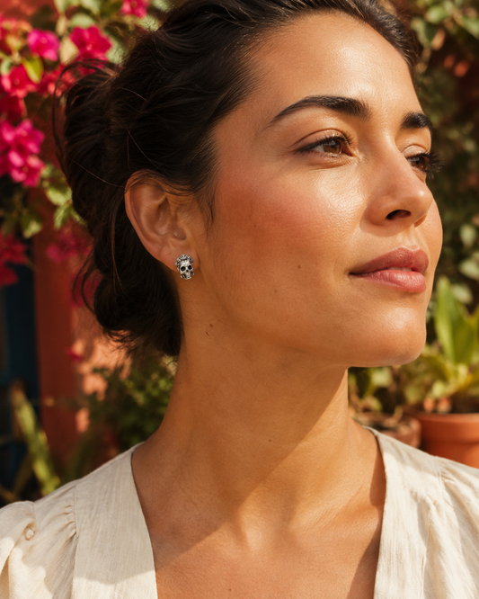 Sterling silver Frida Kahlo sugar skull stud earrings styled as meaningful art-inspired jewellery gift