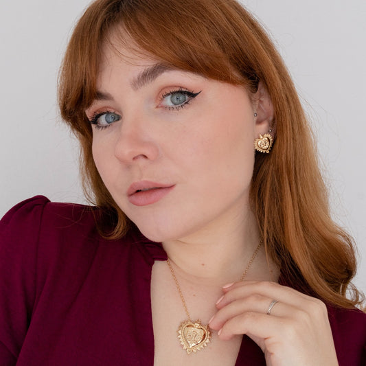 Frida Kahlo gold vermeil heart earrings styled as a meaningful jewellery gift