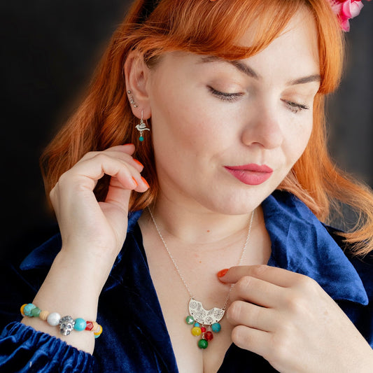 Frida Kahlo Beaded Creole Necklace in recycled sterling silver, featuring a semi-circle pendant with marigold engraving and vibrant semi-precious stone dangles.