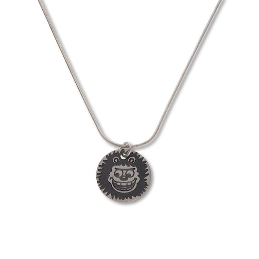 Sterling Silver Gnasher Round Mini Tag Necklace featuring original Beano fan club graphics from 1976. Each mini tag is engraved, oxidised, and hand finished for an authentic Dennis the Menace Fan Club style.