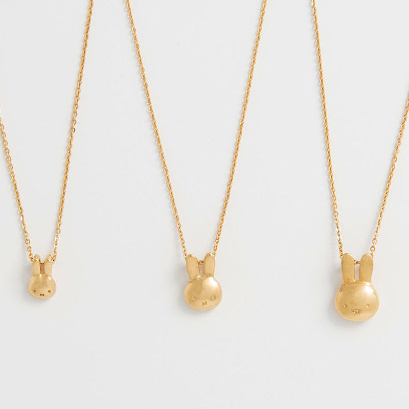 Three 18ct gold vermeil Miffy head necklaces in different sizes displayed on fine chains against a clean white background.