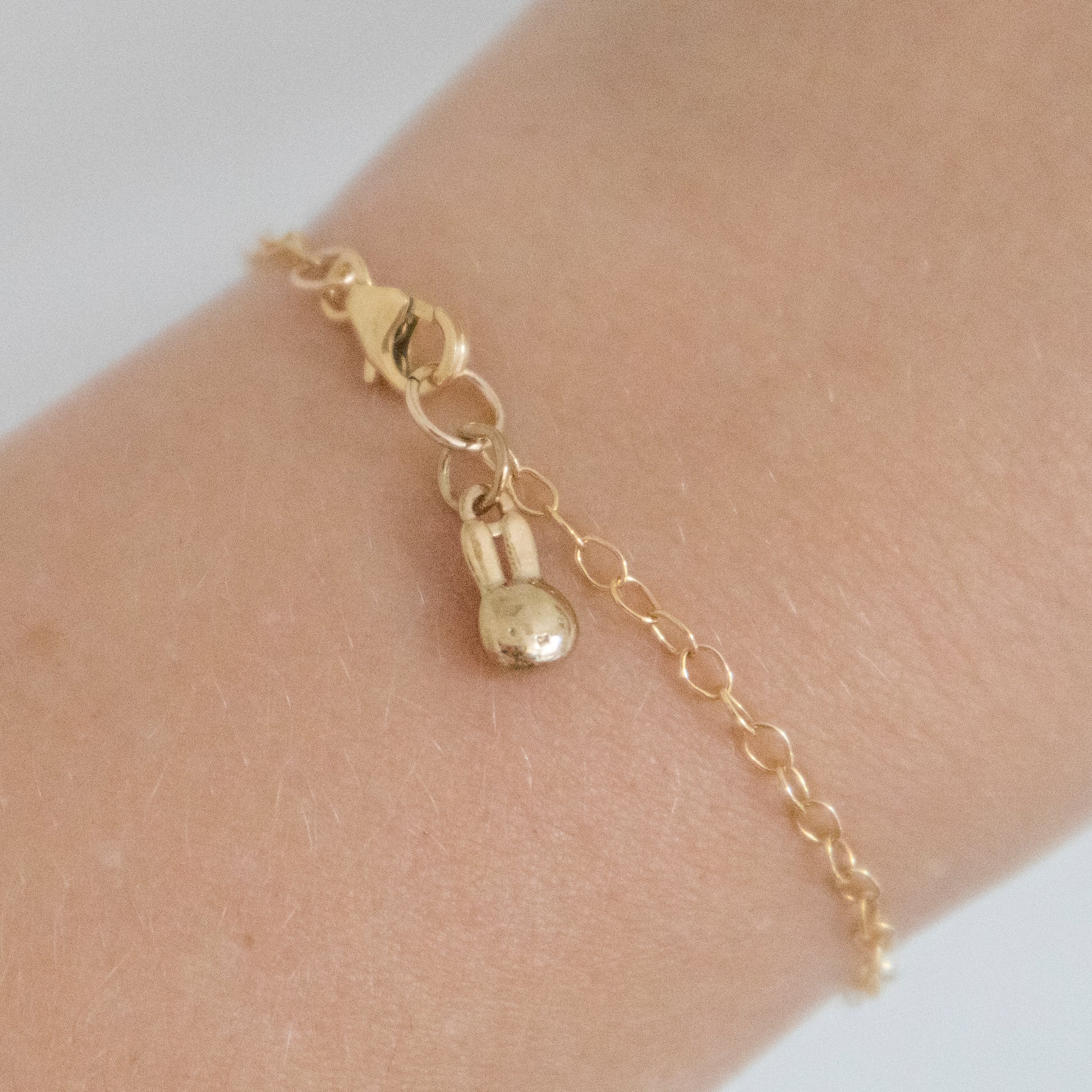 Miffy Single Charm Bracelet displayed on a wrist, showcasing its elegant gold vermeil finish and playful Miffy charm.