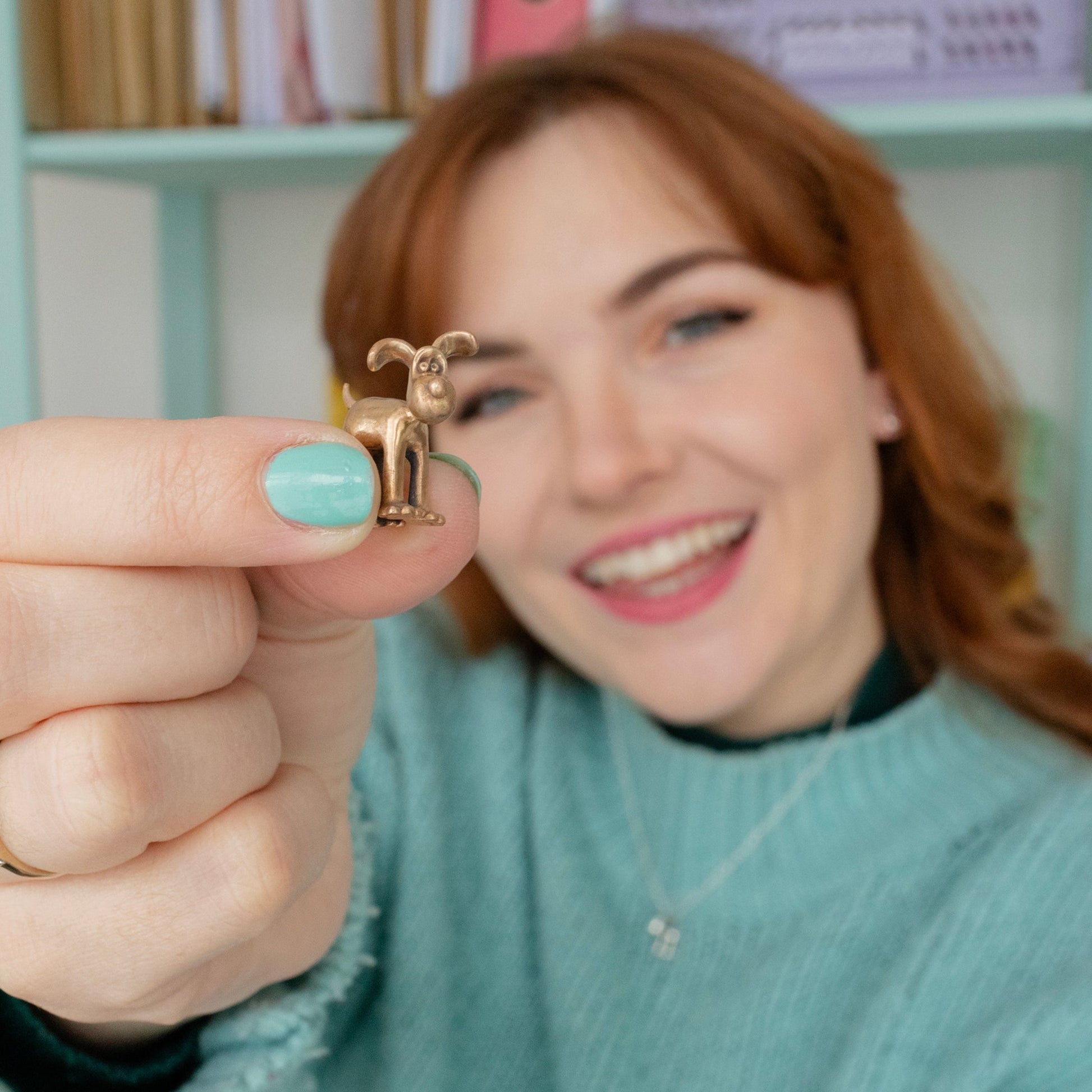 Gromit Miniature Bronze Figurine held in hand to show its small collectable scale.