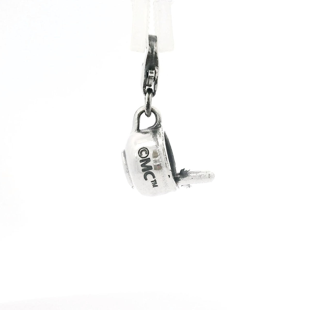 Detailed sterling silver charm of Hattifatteners in a cup, crafted with a clip-on clasp for easy attachment to charm jewellery.