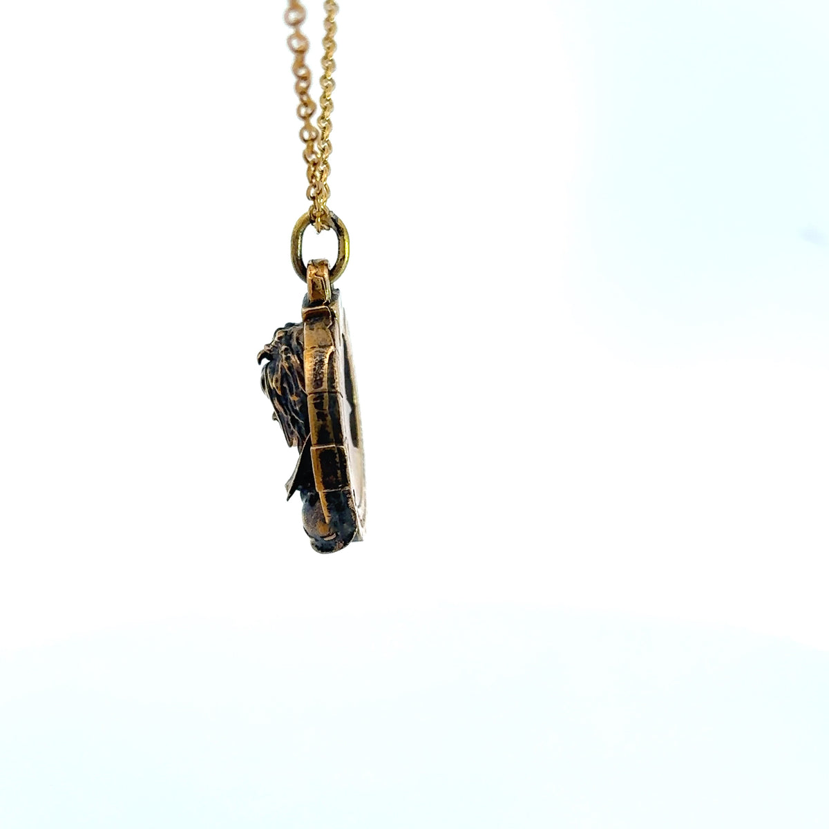 Side view of the Jareth Goblin King bronze necklace showing the sculpted pendant detail
